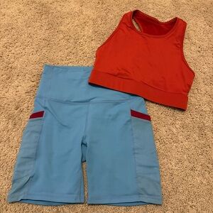 Fabletics Red Sports Bra and Light Blue Bike Shorts Set